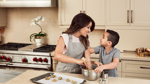 Mother and child are cooking in the kitchen